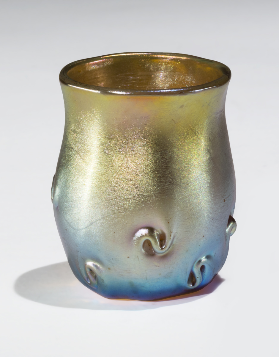 Favrile Toothpick Holder, circa 1895 Iridescent blue and gold glass cup with dimensional s-shaped swirls on bottom