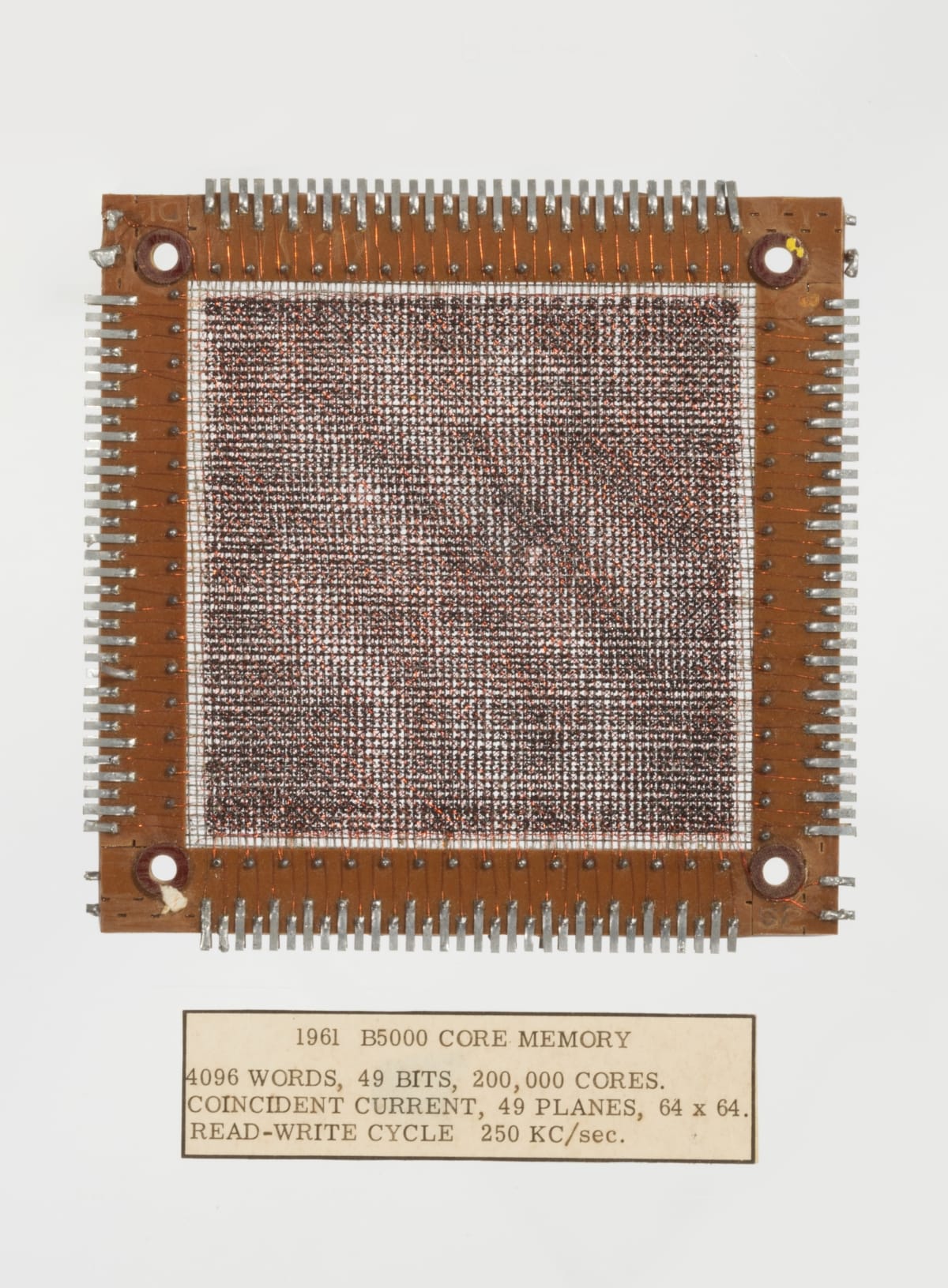 Burroughs B5000 Core Memory Plane, 1961 Square of woven material in frame; also contains text label underneath