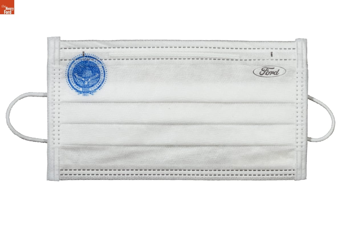 Face Mask, "Inauguration of President and Vice President," 2021 White pleated cloth or paper face mask with Ford logo in upper right and blue circular logo in upper left