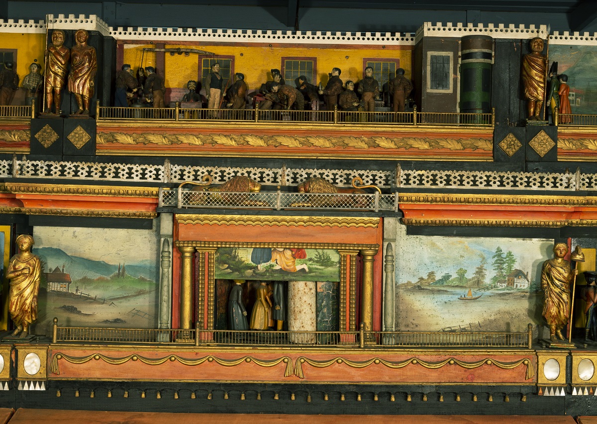 "The Busy World" Automaton, 1830-1850 / detail Wooden platform with two carved scenes with human figures, one above the other