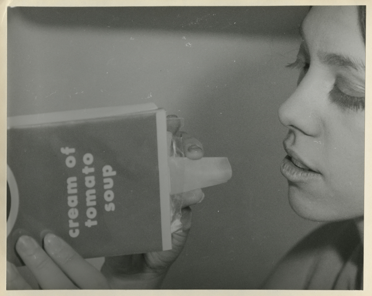 Report, "Habitability Study, Earth Orbital Space Stations, Prepared for NASA," 1968 / page 15B-16, detail Woman holds box labeled "cream of tomato soup" with plastic spout to her mouth