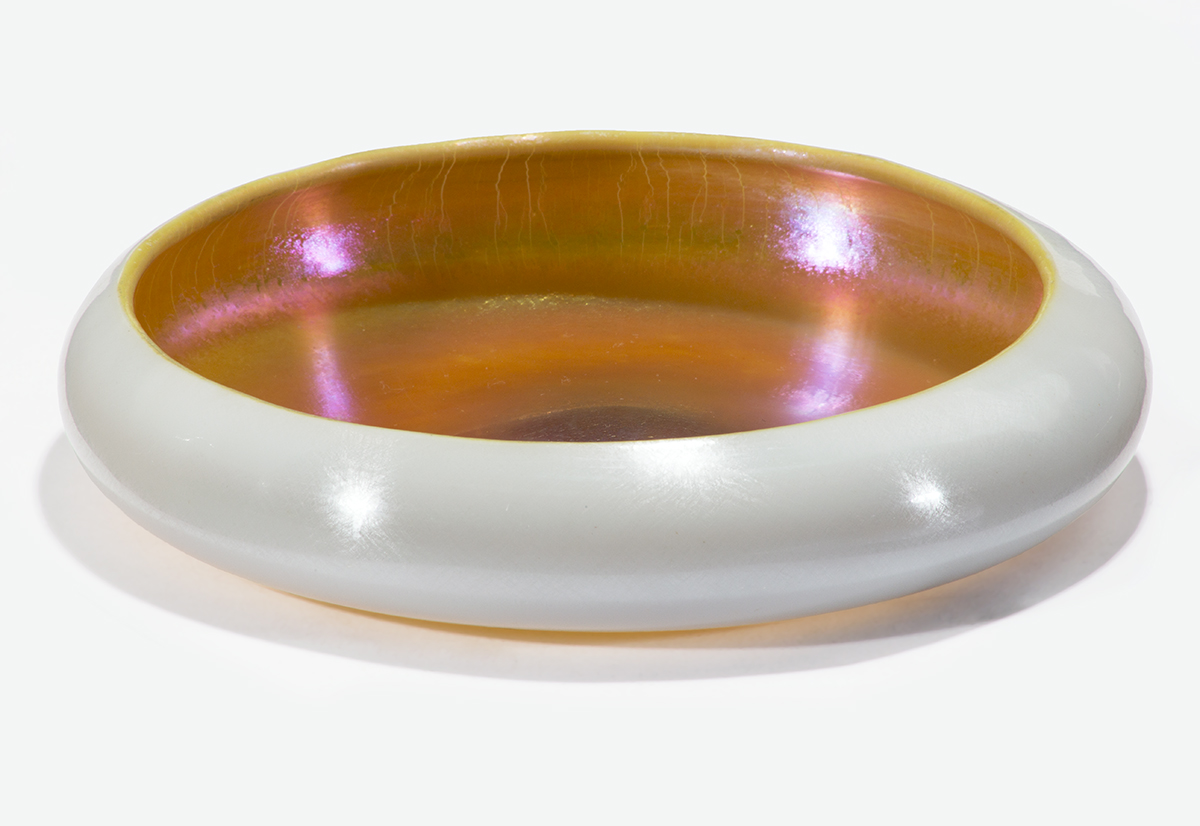 Aurene Bowl, 1915-1930 Low, round glass bowl; white on outside, iridescent amber/gold on inside