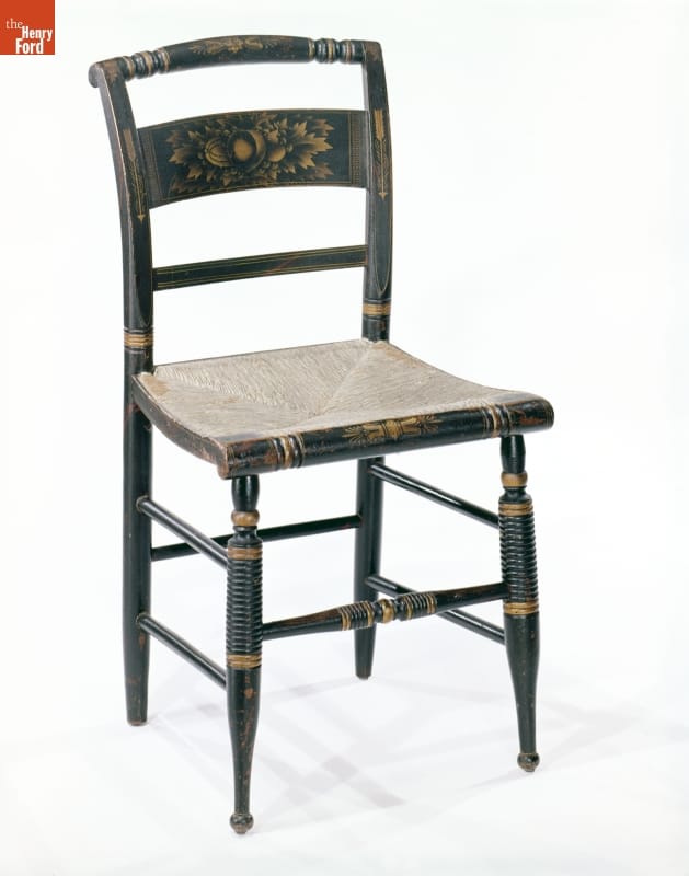 Side Chair, Created by Lambert Hitchcock, 1825-1835 Black wooden chair, with woven seat, painted with gold decoration