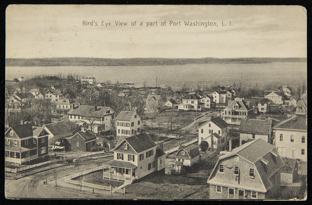 Bird's Eye View of a Part of Port Washington, L.I., circa 1910 Town with two-story wooden houses by a body of water; also contains text