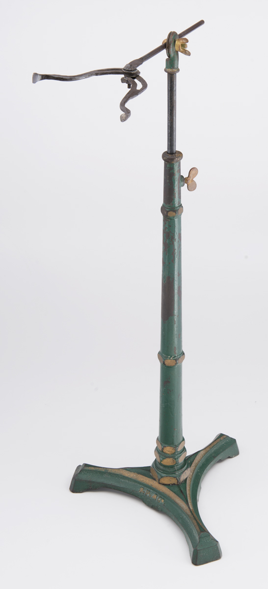 Headrest, Used in Harry Patmore's Photographic Studio, circa 1882 Green and gold metal stand with rounded gold metal piece at top