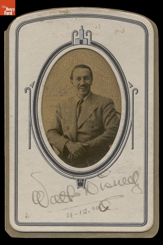 Walt Disney Posing in the Greenfield Village Tintype Studio, 1940 Oval black-and-white portrait of man in suit, matted and signed