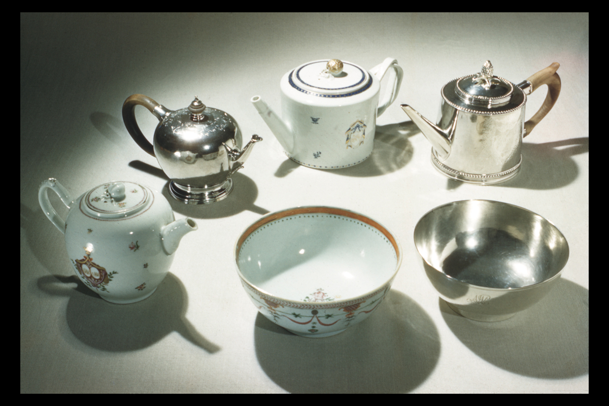 Group of American Silver and China Trade Porcelain; Photographed 1959 Sets of similarly shaped housewares, with one each in silver and ceramic, including two cylindrical teapots, two more spherical teapots, and two bowls