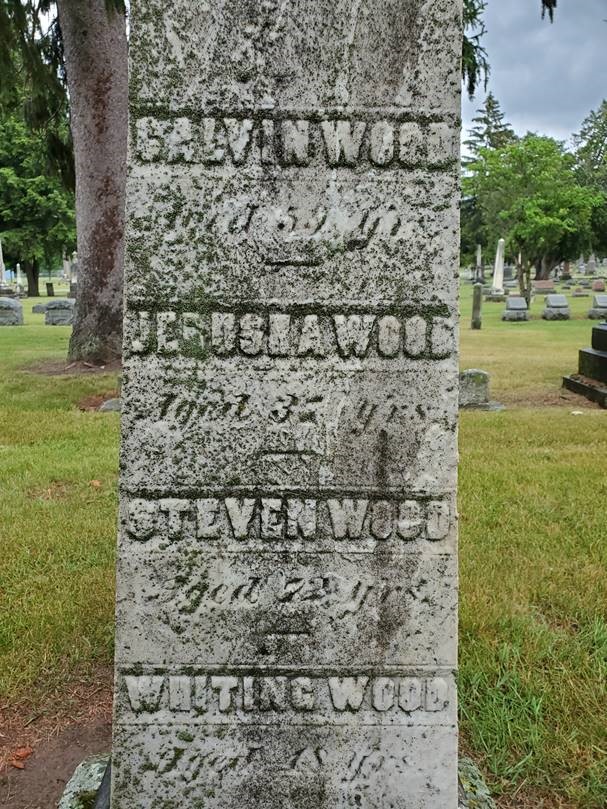 Calvin Wood's tombstone Gray tombstone containing text