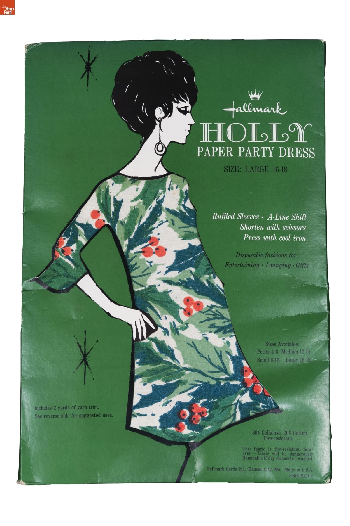 "Holly" Paper Party Dress in Packaging, 1967-1969 Green package with drawing of woman with pink hair, wearing multicolored floral dress; also contains text