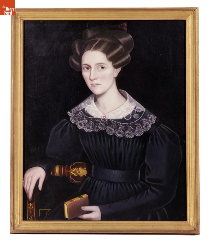 Portrait of Julia Barton Hunting by Ammi Phillips, circa 1830 Portrait of woman with elaborate hairstyle wearing a dark dress with lace collar and holding a book