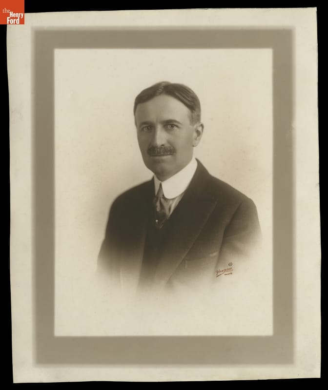 Portrait of Harvey Firestone, circa 1920 Portrait of man in suit with mustache and hair parted in middle