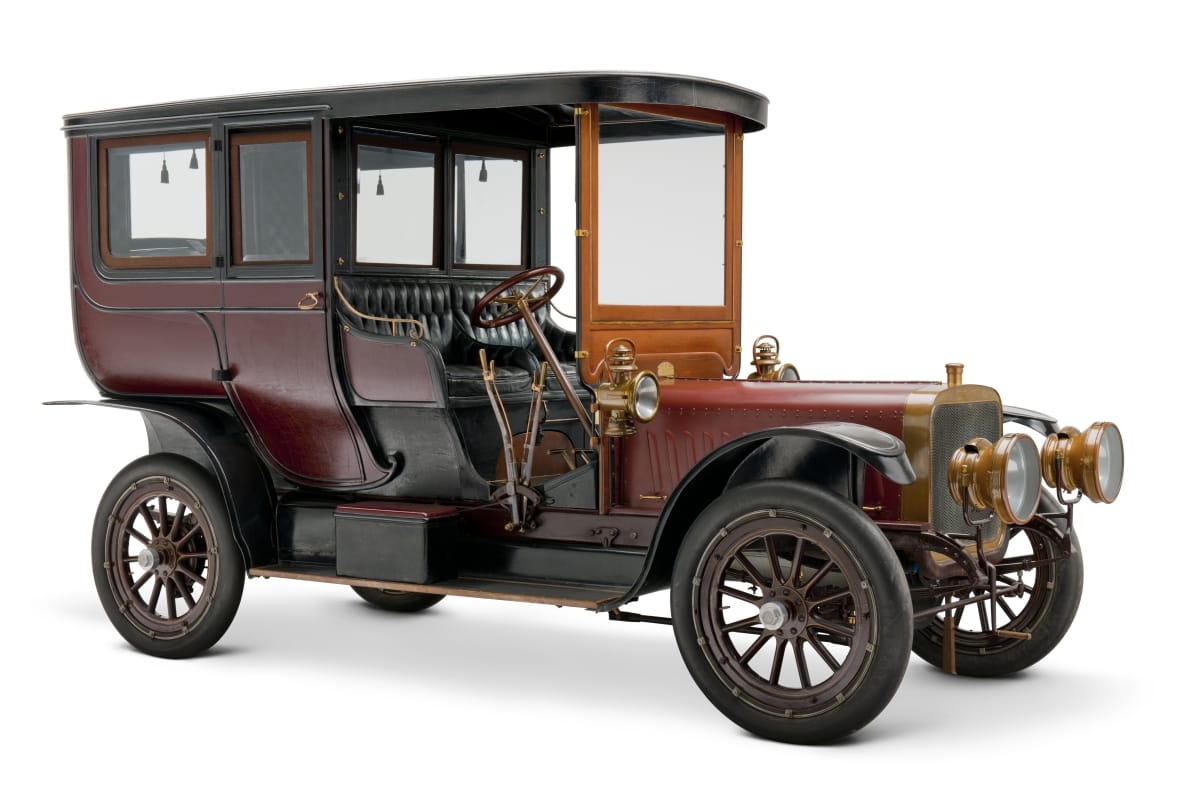 1908 Stevens-Duryea Model U Limousine Long, tall boxy maroon automobile