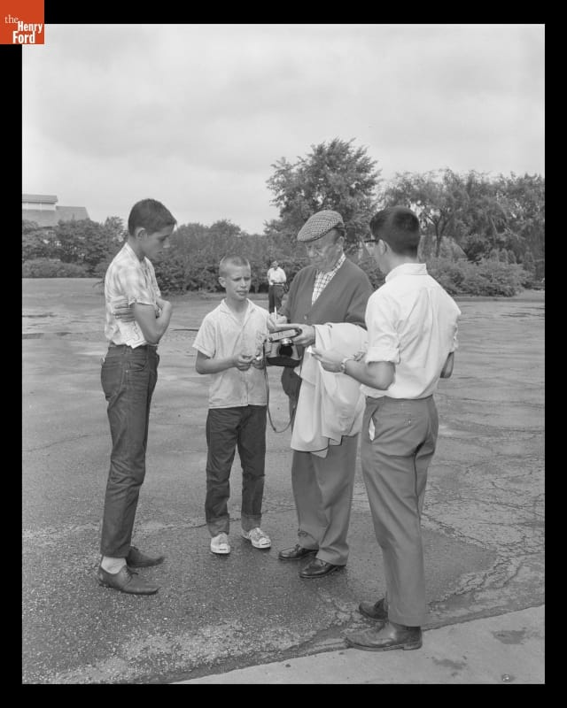 Bert Lahr Signing Autographs during a Visit to Greenfield Village, August 22, 1966 Older man in hat and sweater with three boys