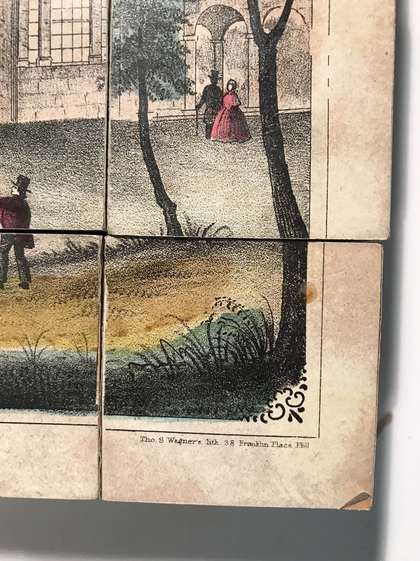 Picture puzzle blocks reference image showing lithographer information Corner of blocks with image and text at lower right corner
