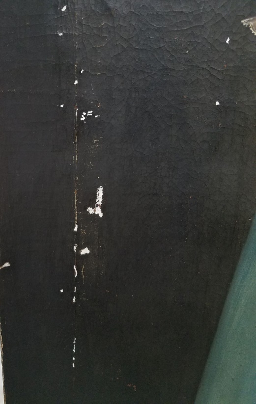 After adding fills to the areas of paint loss Close up of black paint showing white chips