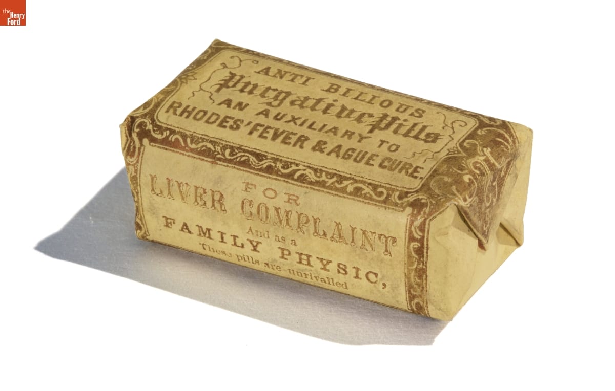 Anti-Bilious Purgative Pills, circa 1880 Rectangular yellow paper package (similar to a wrapped bar of soap) containing decorative edging and text