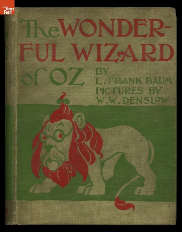 The Wonderful Wizard of Oz, first edition, 1900 Green, red, and beige cover with illustration of lion and text
