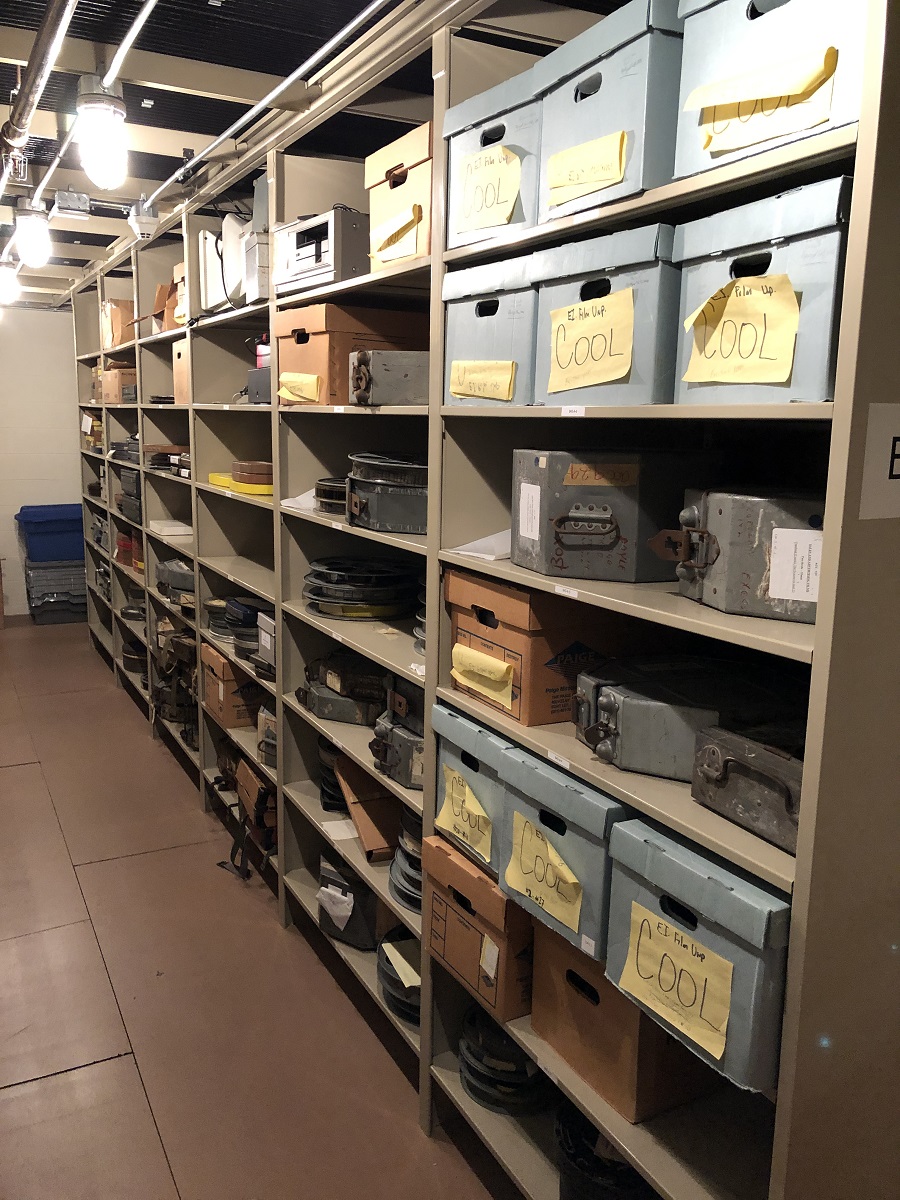 Filled shelving in the archives of The Henry Ford Shelves containing a variety of labeled archival boxes