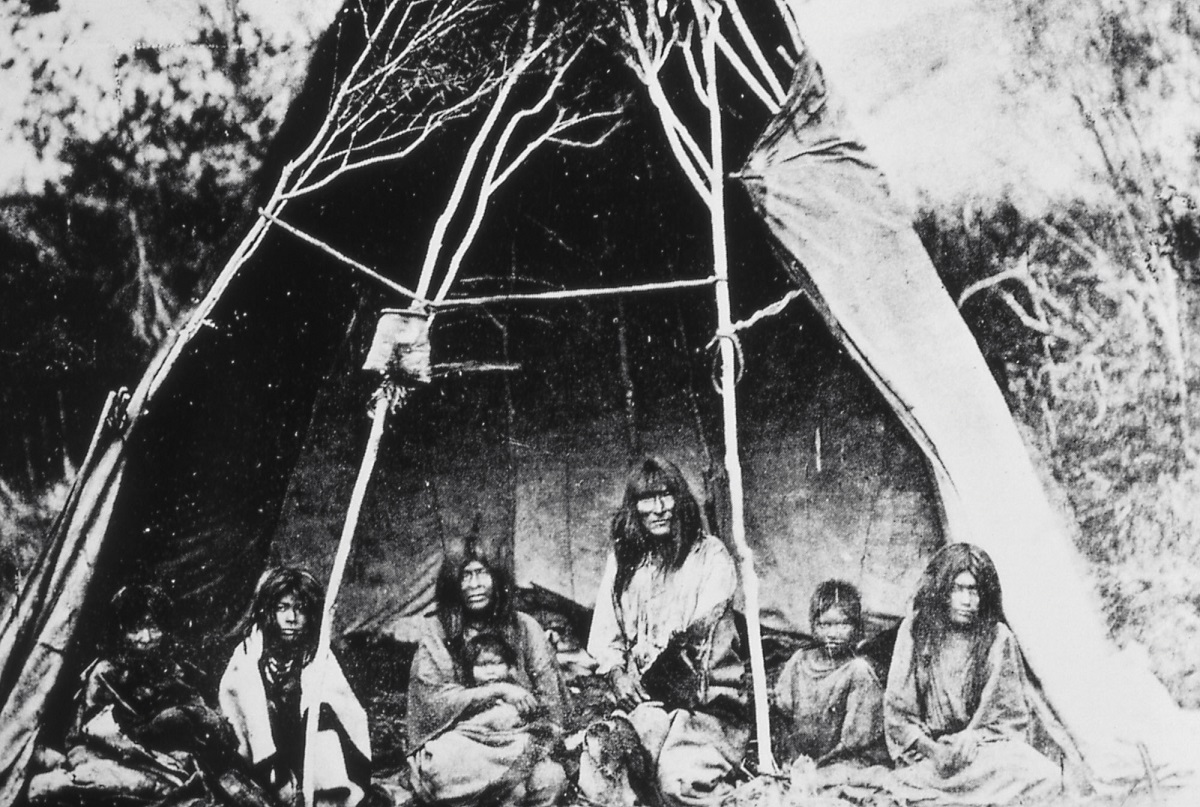 Photo of "Sheepeater" Shoshone, William Henry Jackson, 1871 Black-and-white photo of Indigenous people in a dwelling or teepee