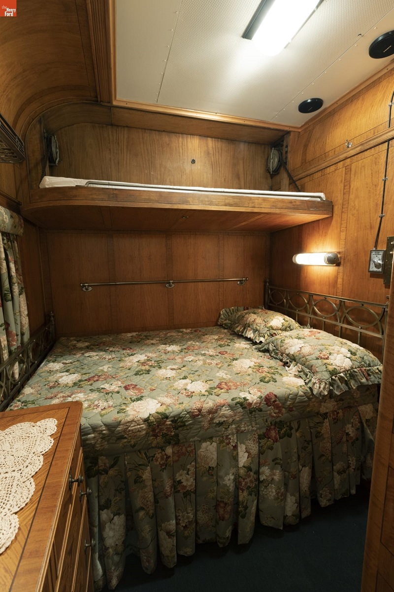 Henry Ford's Private Railroad Car "Fair Lane," 1921 / bedroom Room with wooden paneling, bed with shelf over it, and arched celing