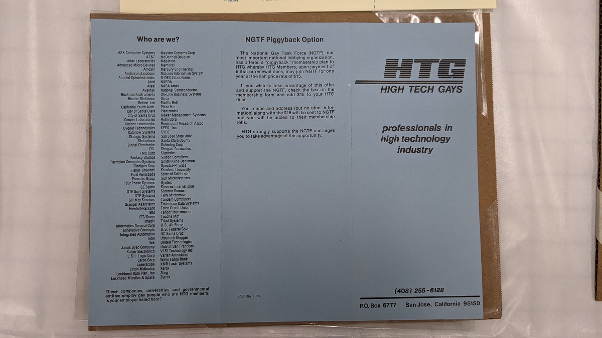 High Tech Gays flier Tri-fold page with text under plastic mounted on cardboard