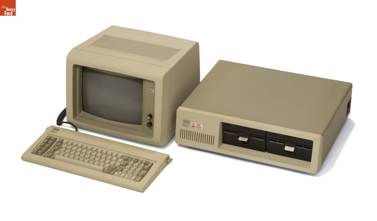 IBM Personal Computer, Model 5150, 1984 Horizontal computer processor with two disk drives, monitor, and keyboard