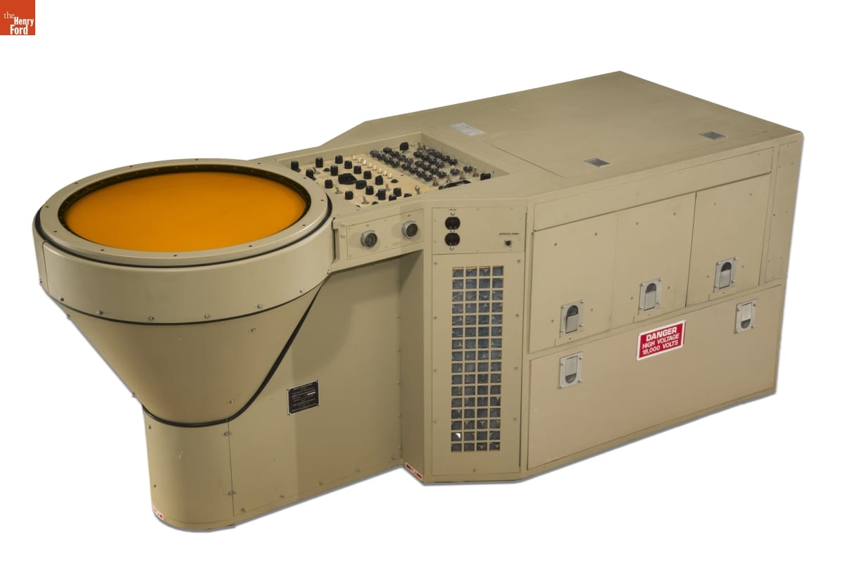 Air Traffic Control Radar Scope, 1969 Large piece of beige metal equipment with round yellow screen (?) at one end and buttons and switches