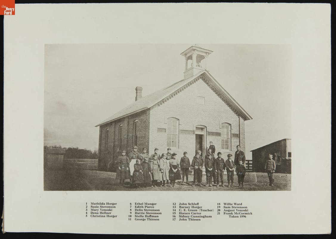 Group outside Scotch Settlement School at Its Original Site, Dearborn Township, Michigan, 1896 Group of children pose outside of a small brick building; also contains text key with the names of those in the photo