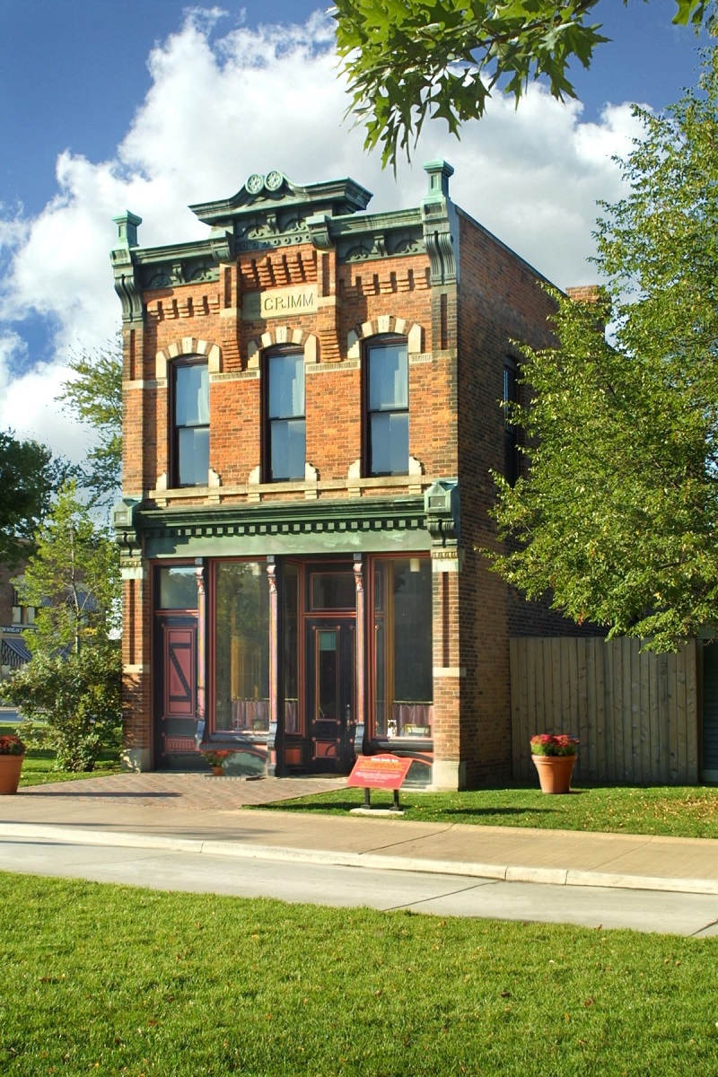 Grimm Jewelry Store in Greenfield Village Narrow, two-story red brick building with decorative windows and cornice