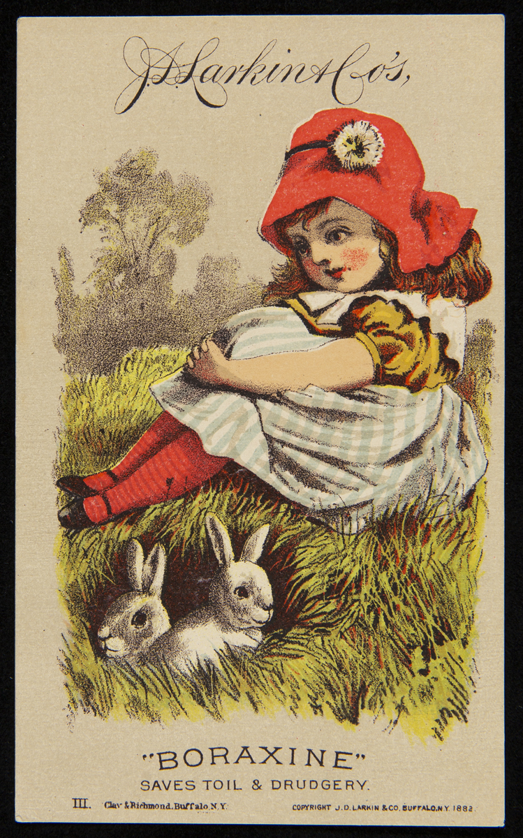 Trade Card for "Boraxine" Soap, J.D. Larkin & Co., 1882 Card with drawing of young girl wearing red hat, red tights, blue checked dress, sitting on grass with two white rabbits nearby; also contains text