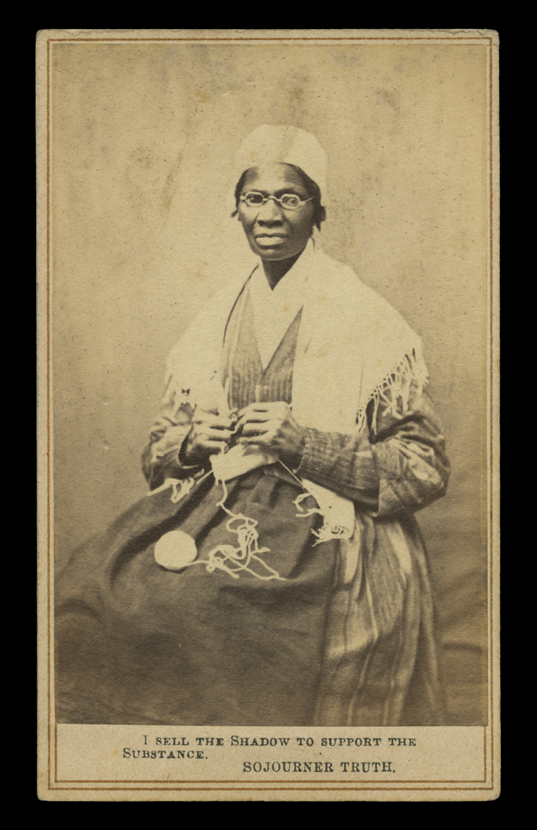 Portrait of Sojourner Truth, "I Sell the Shadow to Support the Substance," circa 1864 Sepia portrait of African American woman in a dress and shawl seated in chair, knitting, with text at bottom “I sell the shadow to support the substance – Sojourner Truth”