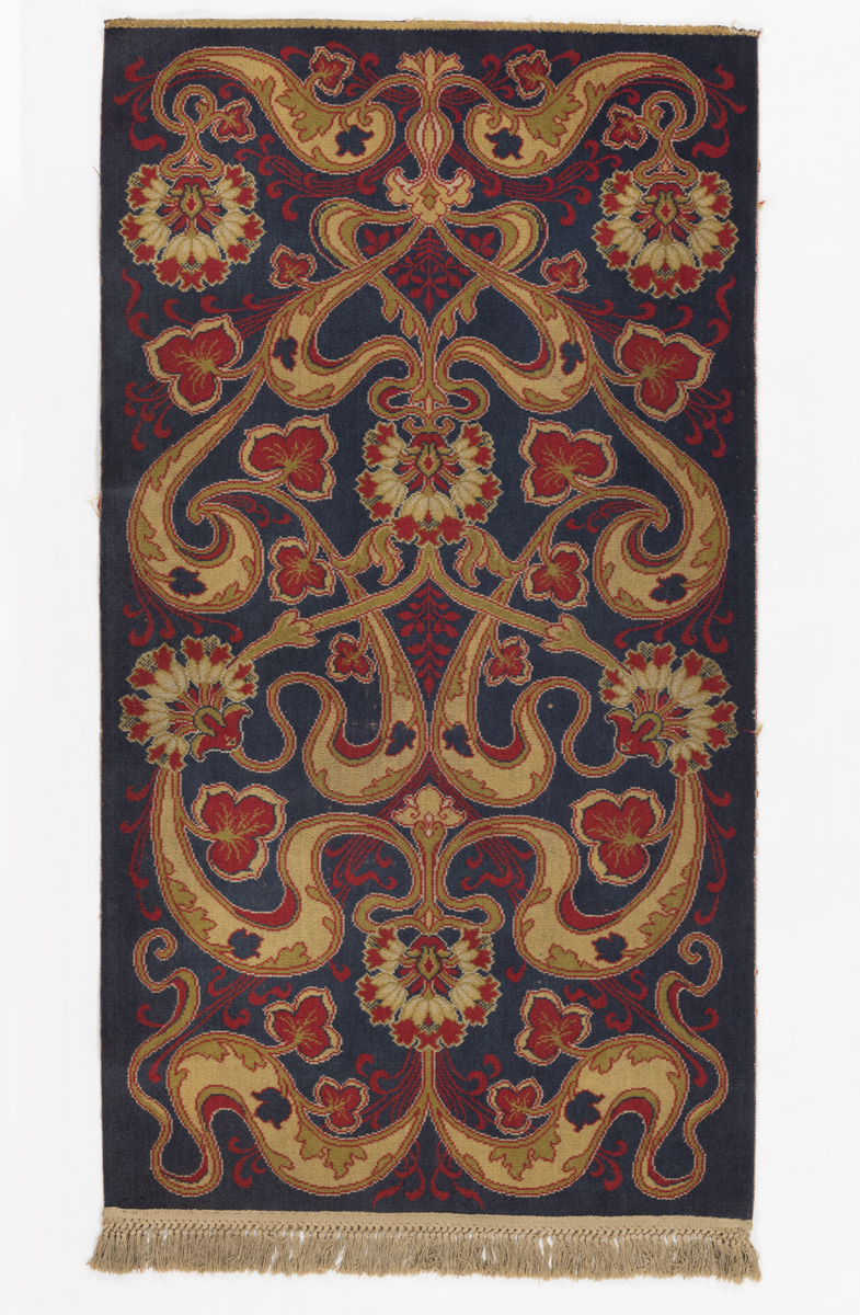 Wilton Rug, circa 1900 Black, red, and beige floral-patterned rug
