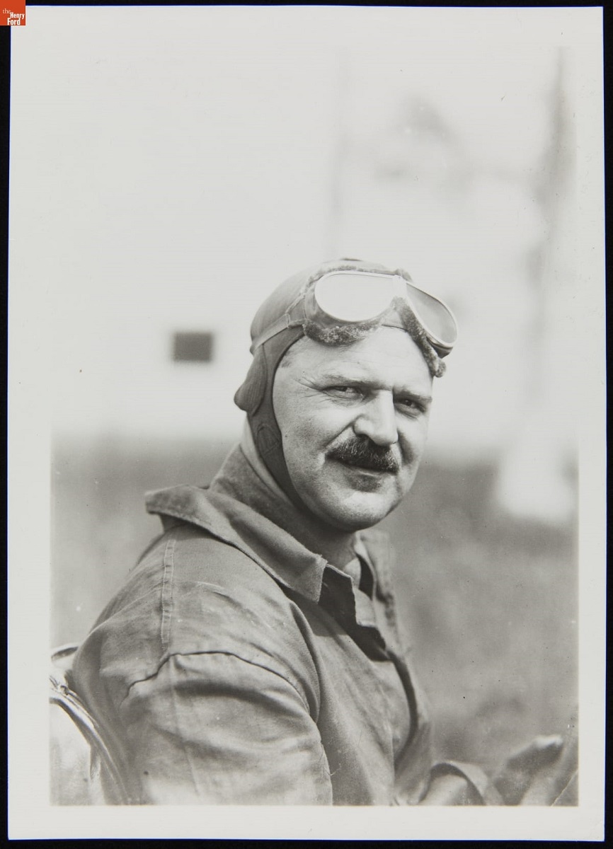 Race Driver Louis Chevrolet, circa 1913 Man with broom mustache in jacket and soft racing helmet, with goggles pushed up on forehead
