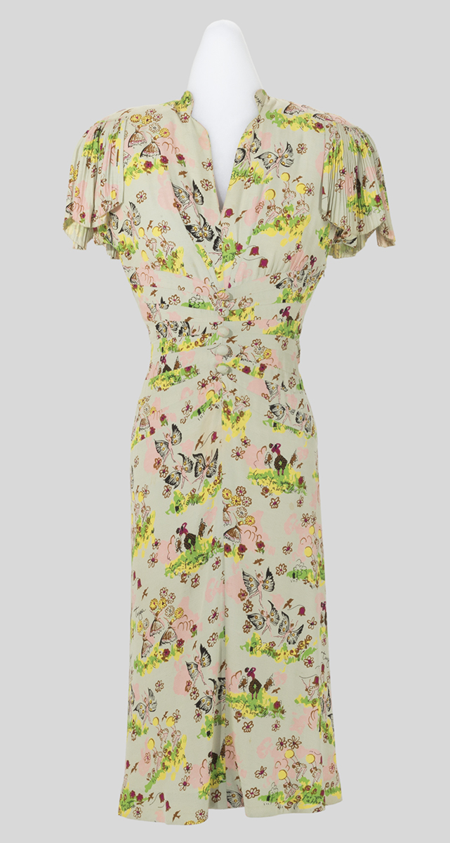 "Tuya" Day Dress by Samuel Kass, Worn by Augusta Denton Roddis, 1945 Beige dress with pattern of flowers and fairies, short flutter sleeves, and mid-calf skirt