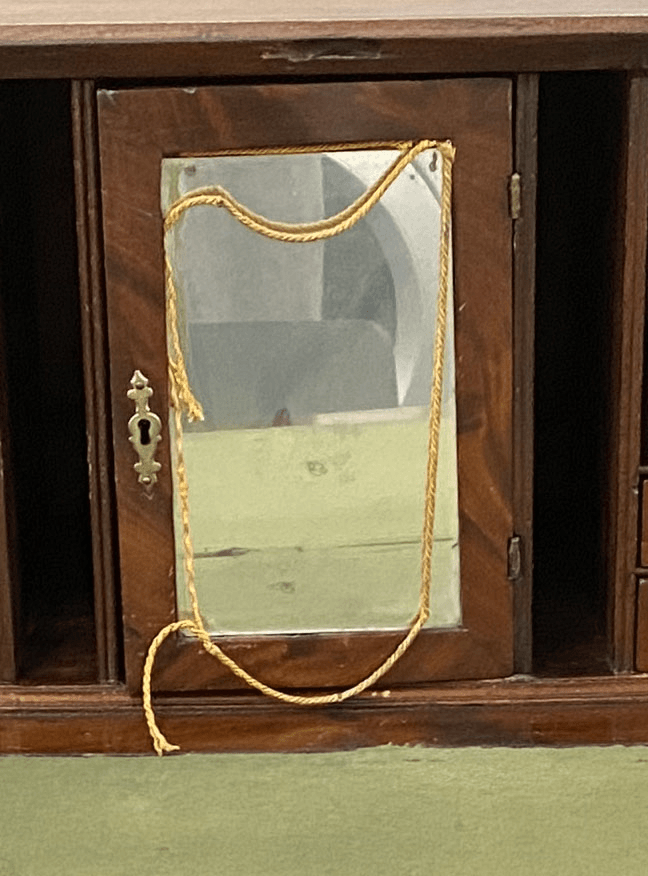 Gif What's behind the door What’s behind the mirrored door?