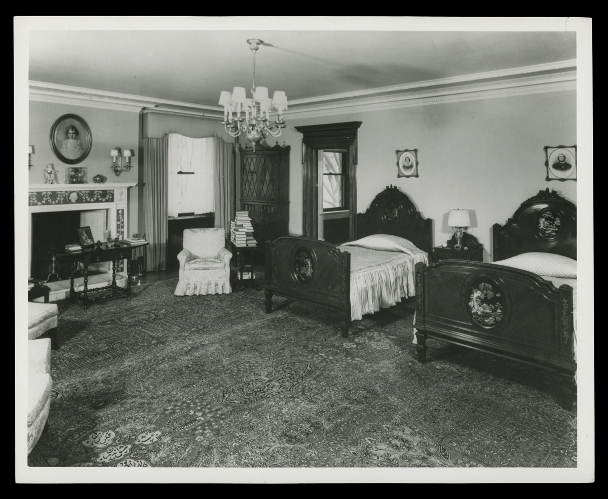 Master Bedroom at Fair Lane, Home of Henry Ford, April 1951 Bedroom interior with two twin beds, a fireplace, and other furniture
