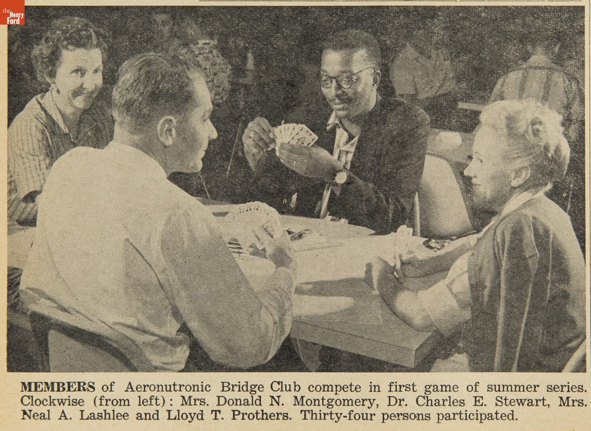 Aeronutronics News, Volume 1, March-December 1960 Black-and-white photo of four people sitting around a table playing cards; other similar tables of people visible in background