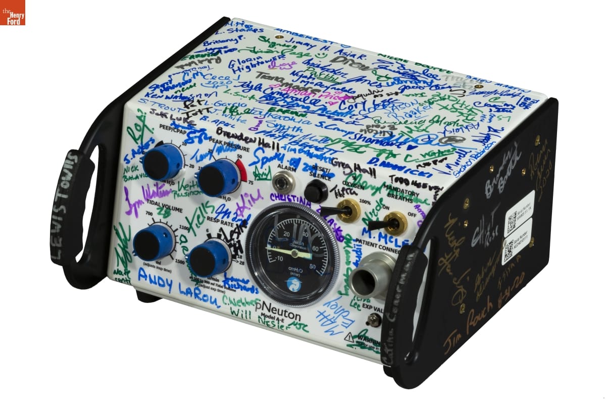 pNeutron Model A-E Pneumatic Ventilator, Signed by Rawsonville Components Plant Employees, 2020 Piece of white machinery with black handles and dials and knobs on the front; covered in people's signatures in various colors