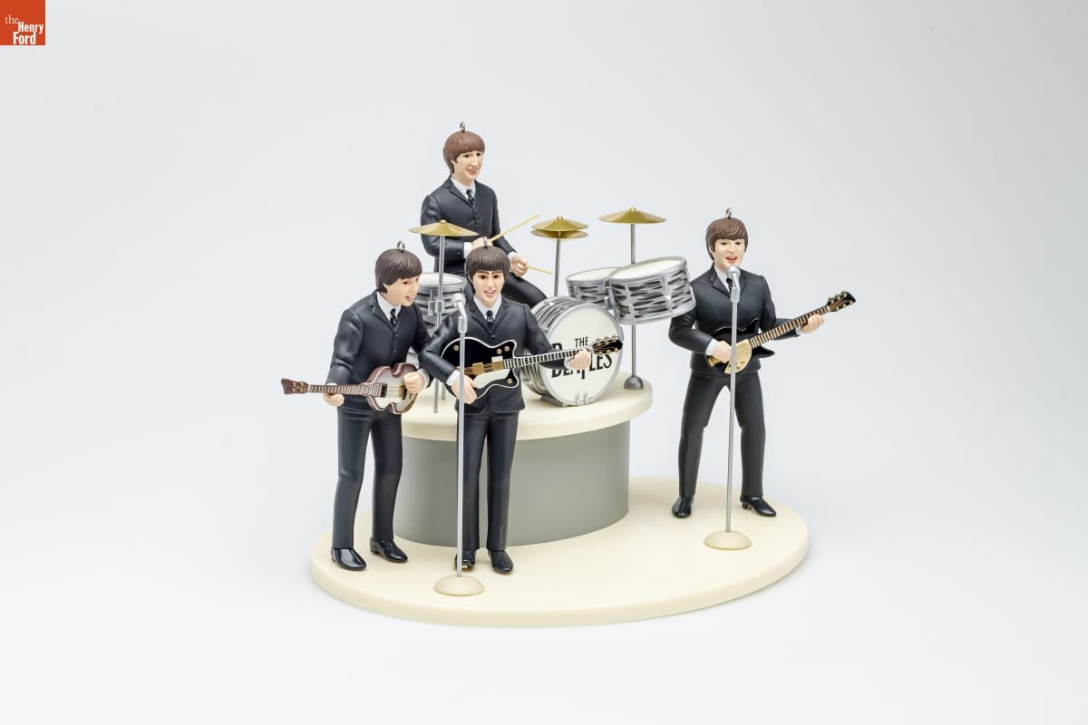 Hallmark "The Beatles Gift Set" Christmas Ornament, 1994 Ornament depicting four men in identical black suits, three holding guitars and one seated at a drum set