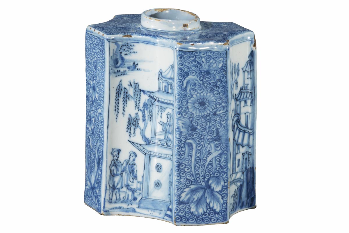 Tea Caddy, 1740-1770 Unusually shaped white jar with blue decorations of flowers, vegetation, people, and buildings