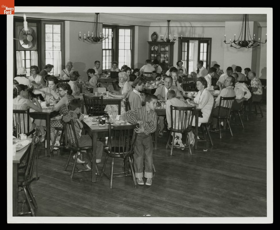 Visitors Lunching at the Clinton Inn (now Eagle Tavern), Greenfield Village, 1958 Room filled with people eating at small square tables