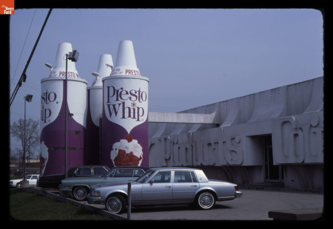 Presto Whip Building, Dearborn, Michigan, 1976 Building, parking lot, and something formed to look like three giantic cans of "Presto Whip" canned whipped cream
