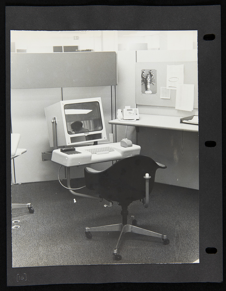 Page from Report on the SRI Fall Joint Computer Conference, December 27, 1968 Office cubicle with chair in front of computer with large boxy monitor