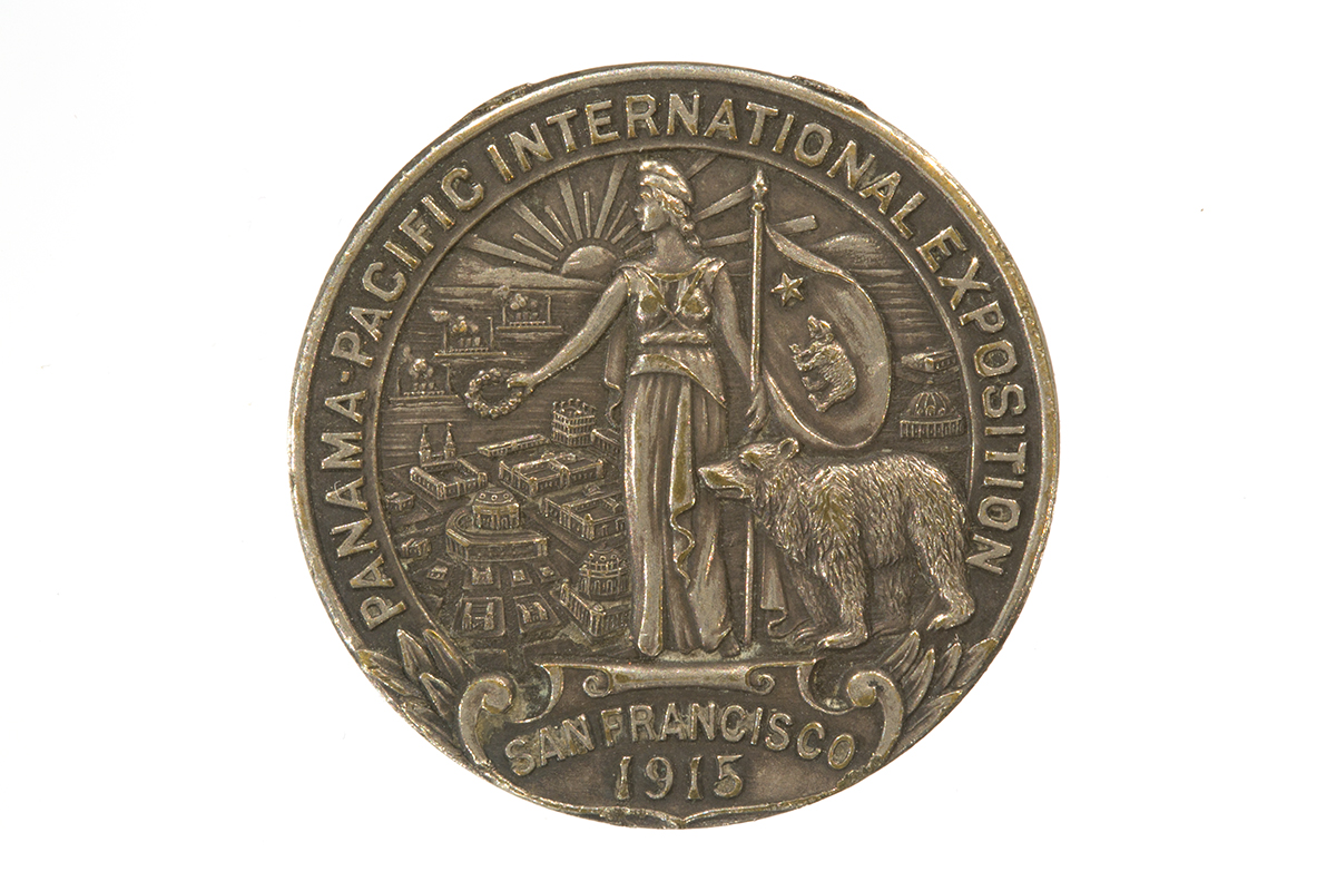 Panama-Pacific International Exposition Souvenir Medal, 1915 Round medallion with text and image of a woman holding a flag, a bear, and buildings