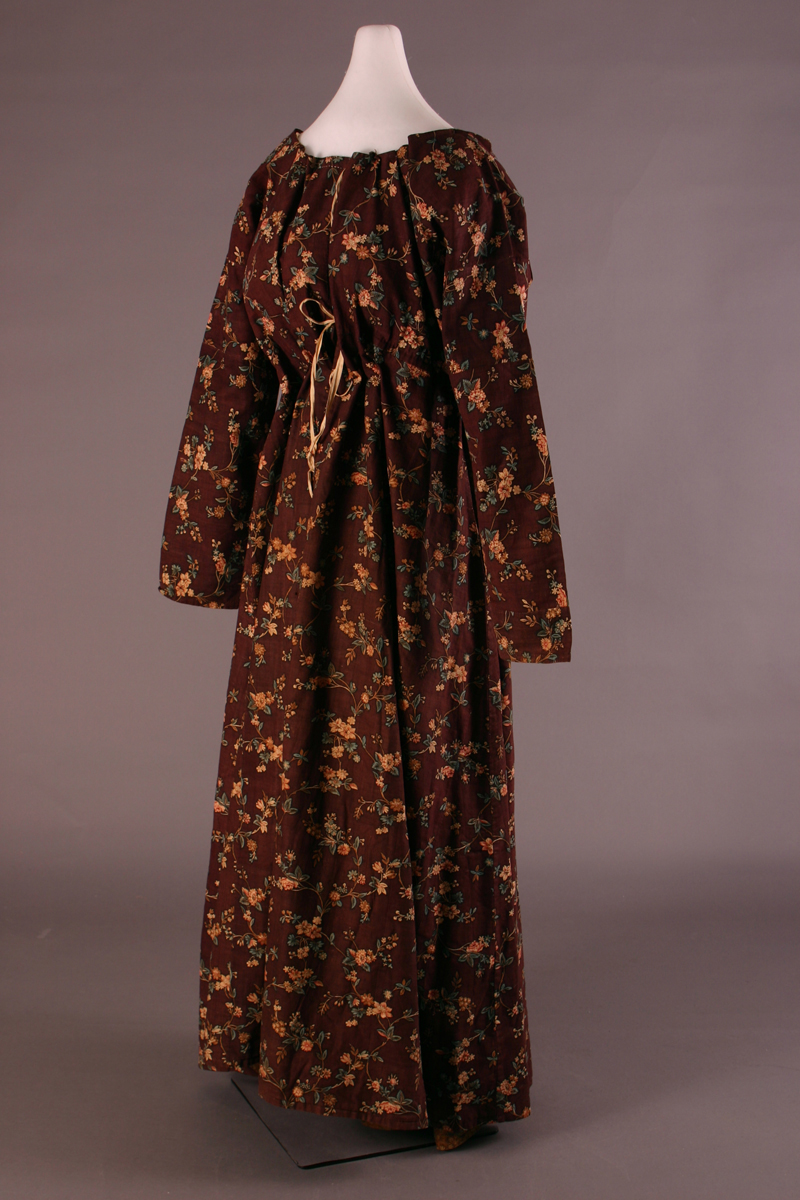 Morning Dress, 1780-1795 Long-sleeved, floor-length dress gathered at waist and neck, made of brown floral material