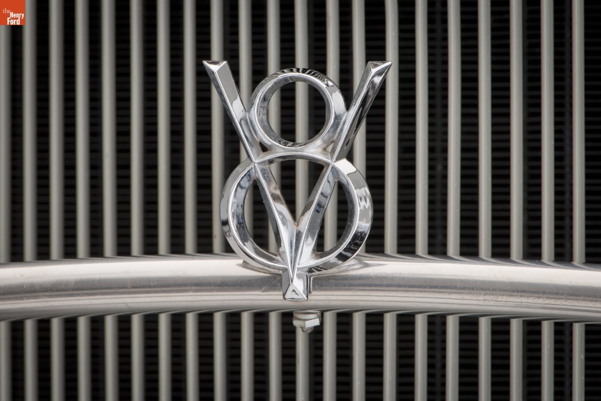 1932 Ford V-8 Victoria / badge Close-up of car grille with V-8 icon