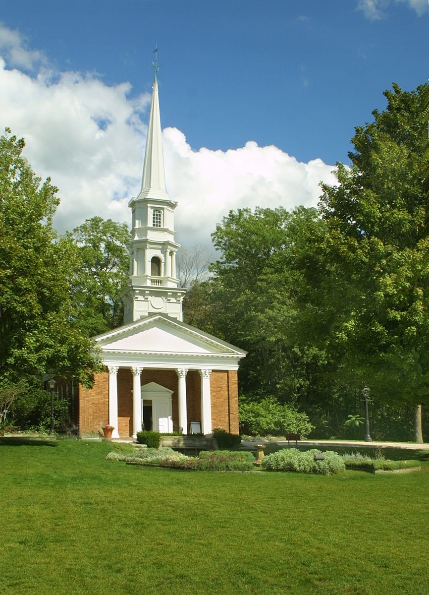 Martha-Mary Chapel Red brick and white wood building with columns out front and steeple