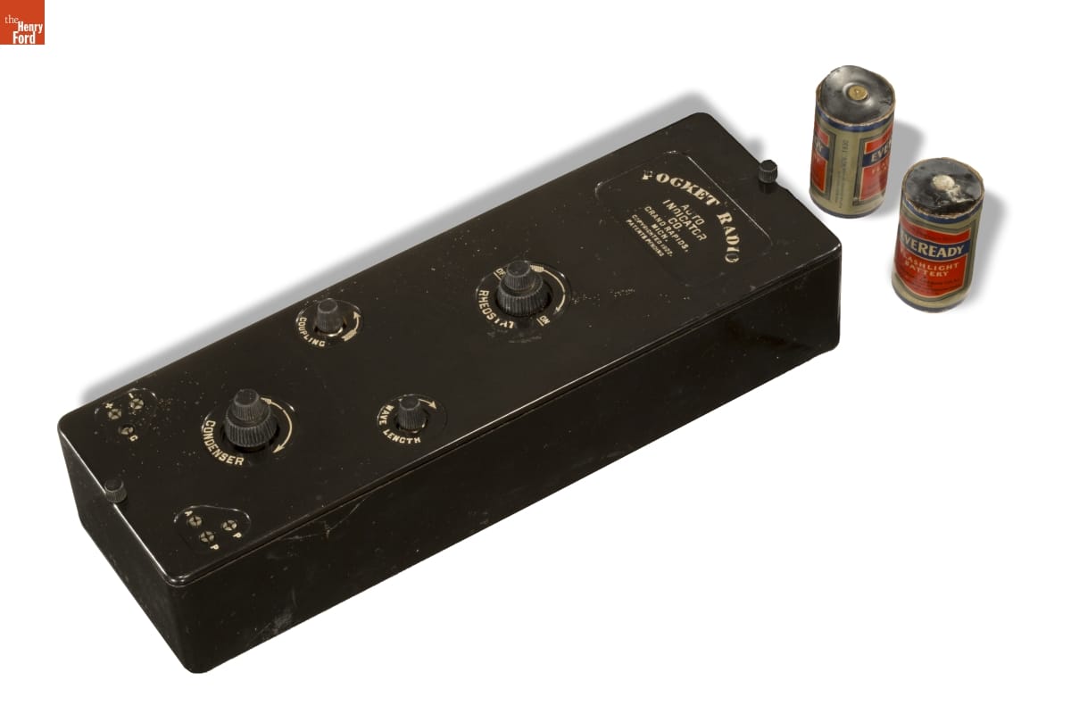 Pocket Radio, circa 1925 Black box with knobs and text; two batteries at side