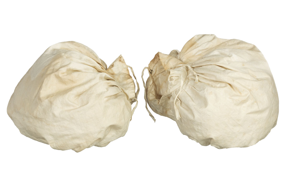 Sleeve Puffs, circa 1830 White sacks filled with something and gathered with ribbon at necks