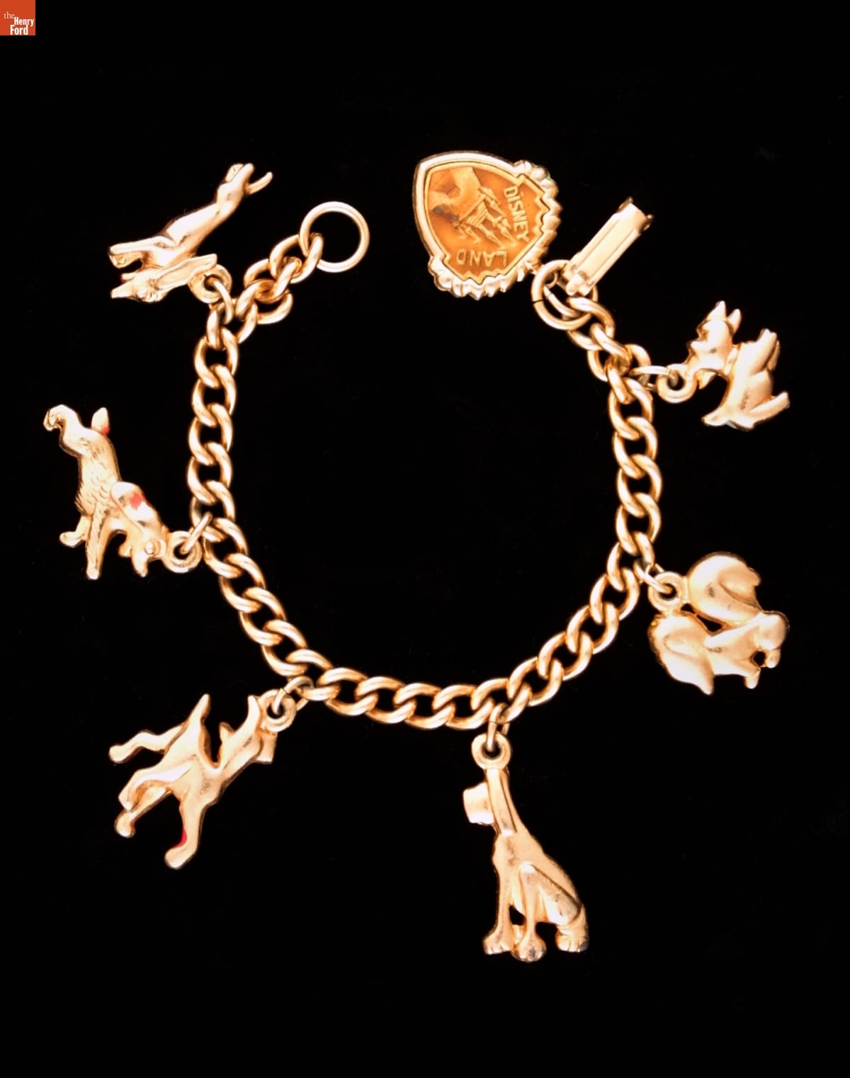 Lady and the Tramp Charm Bracelet, circa 1955 Gold bracelet with six charms of dogs attached